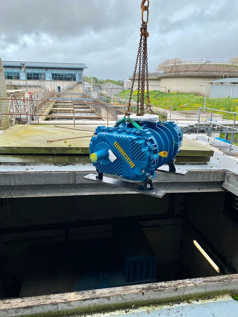 New Robuschi blower on crane chains over an open roof hatch, aeration lanes behind