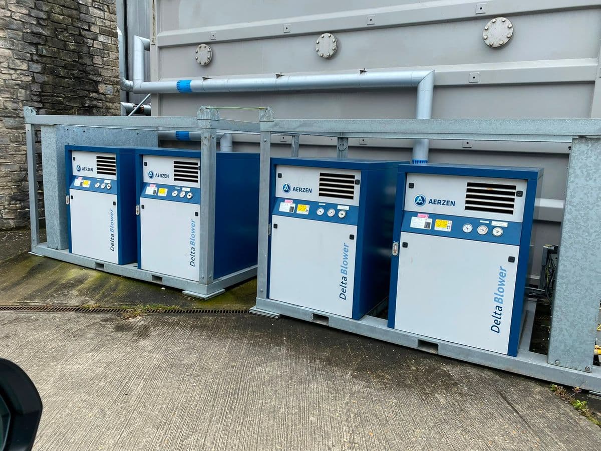 Four mobile hire blowers in galvanised transport frames
