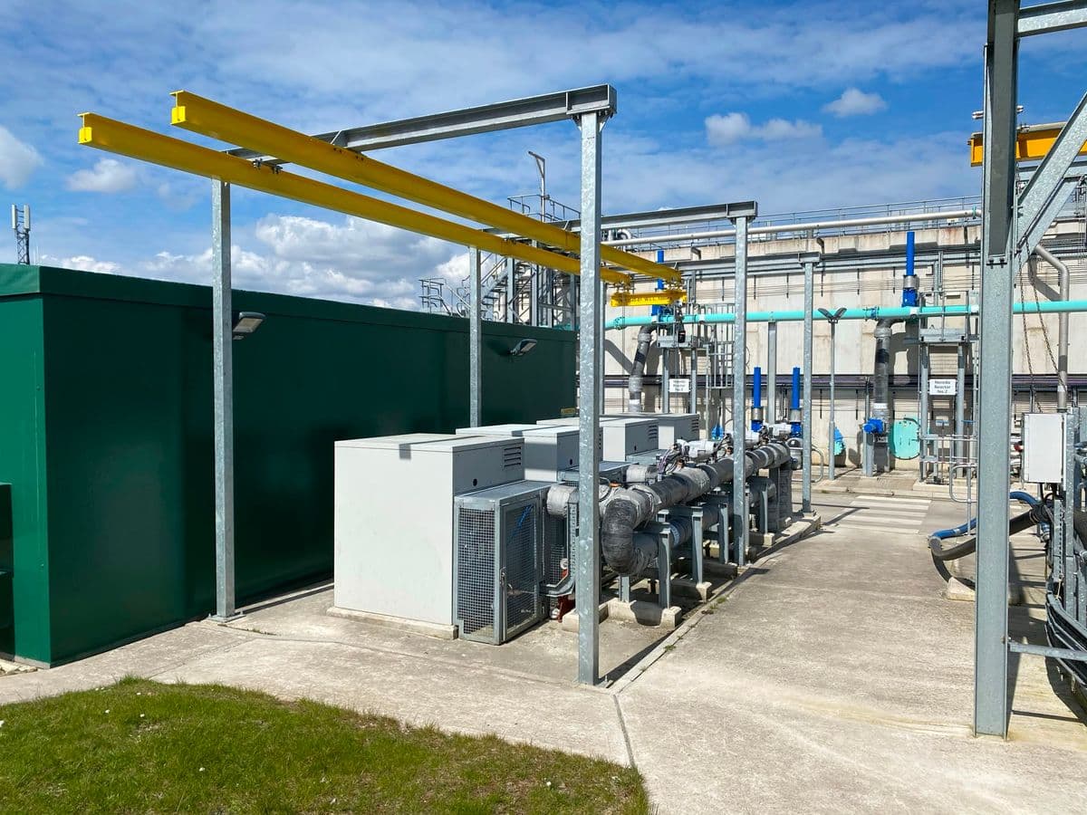 Outdoor blower compound with grey acoustic canopies and lagged pipework
