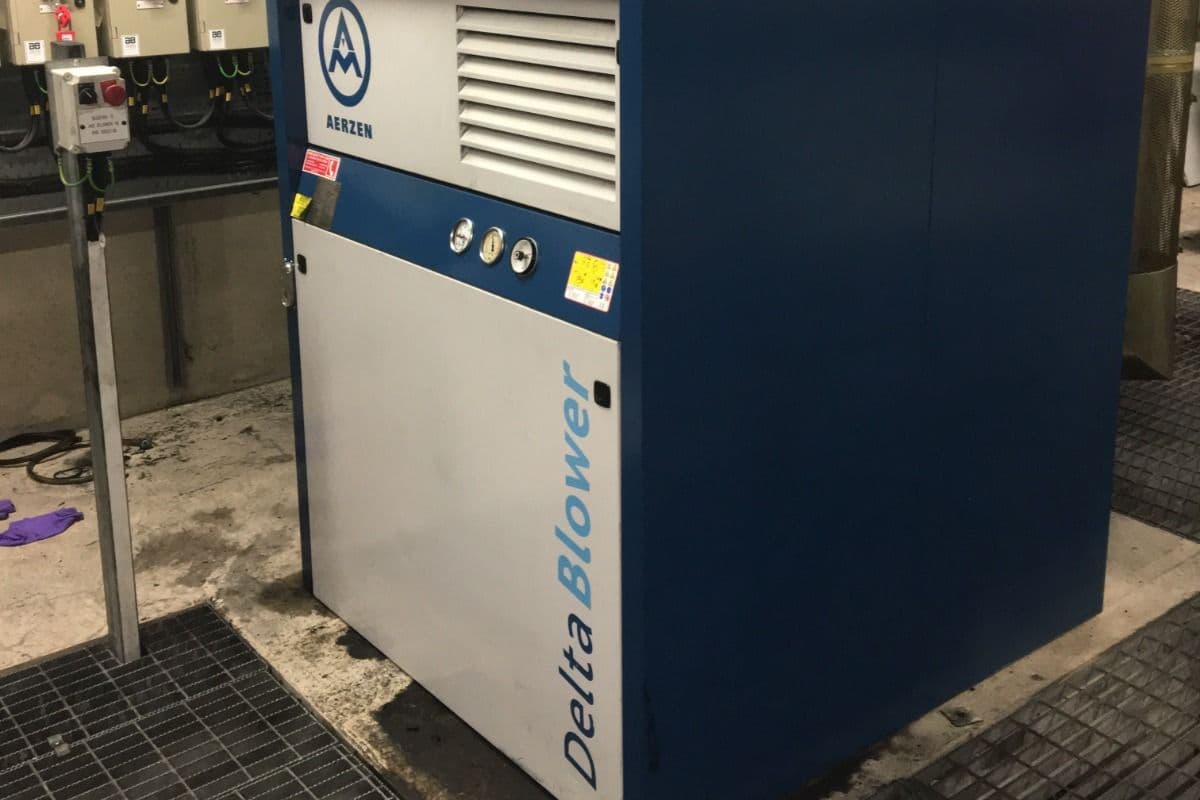 Aerzen Delta Blower package installed on grating in a basement plant room
