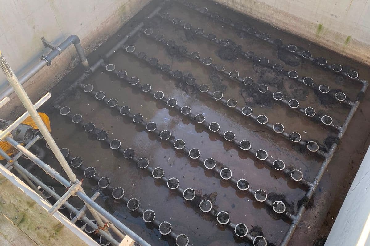 Drained aeration tank seen from above with its disc diffuser grid exposed